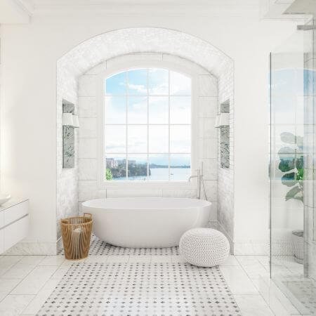 A white bathroom with a large window and a tub.