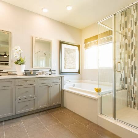 Luxurious master bathroom featuring shower, sink, and tub.