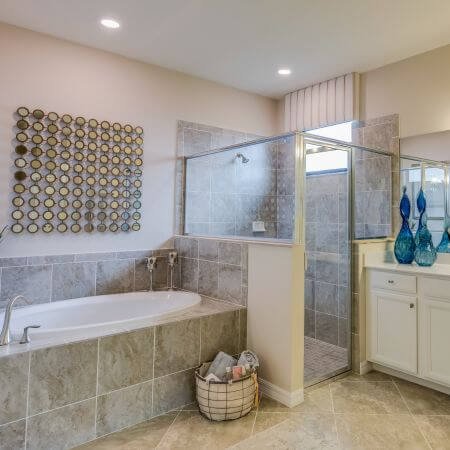 Large bathroom featuring walk-in shower and tub. Step Thru Inserts