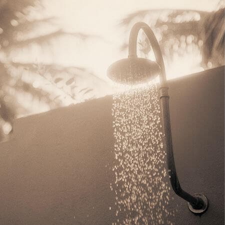 A lovely sunset and water coming out of a shower head.